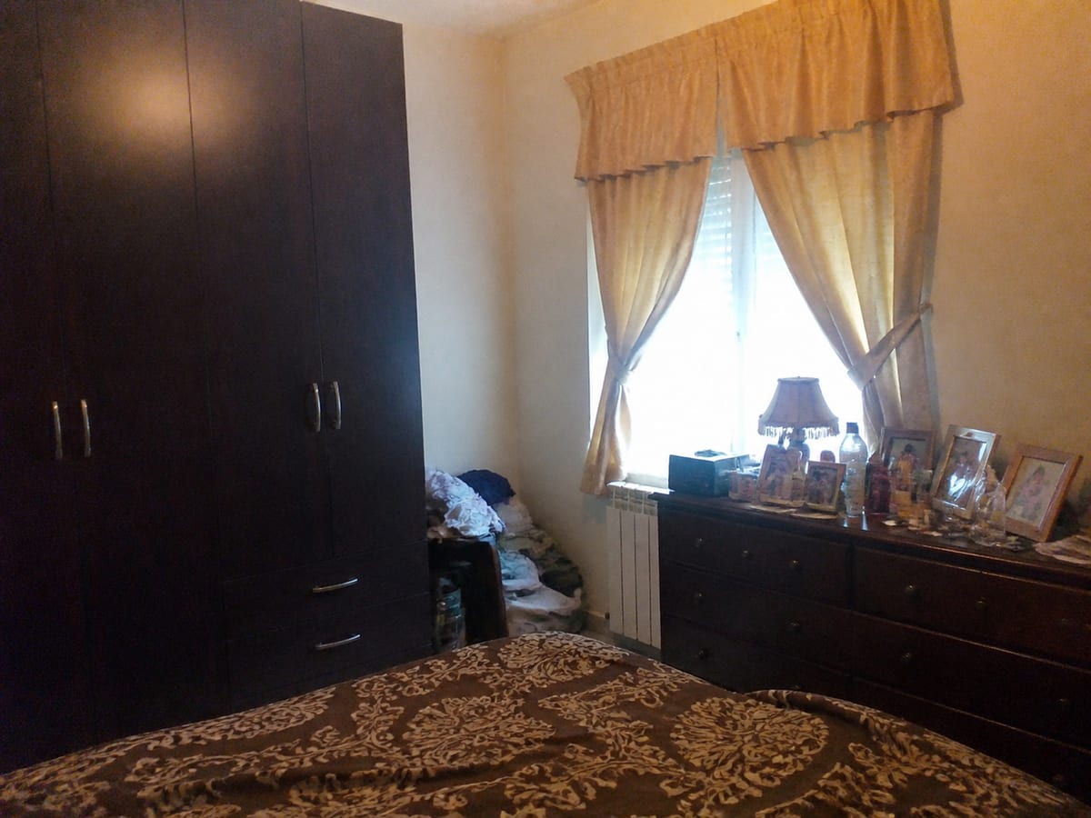 Dated bedroom redesigned in a quiet luxury style (before)